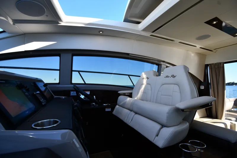 Slide: The Image of Interior of 2017 Sea Ray Sundancer 400 yacht with luxurious seating and navigation controls. - 42
