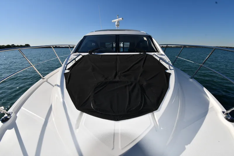Slide: The Image of 2017 Sea Ray Sundancer 400 yacht on water, front view with clear sky. - 5