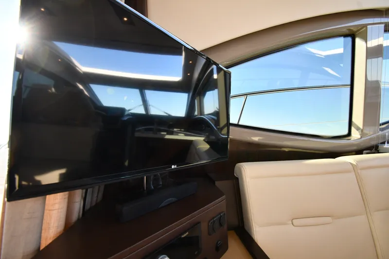 Slide: The Image of Interior of 2017 Sea Ray Sundancer 400 yacht with TV and seating area. - 47