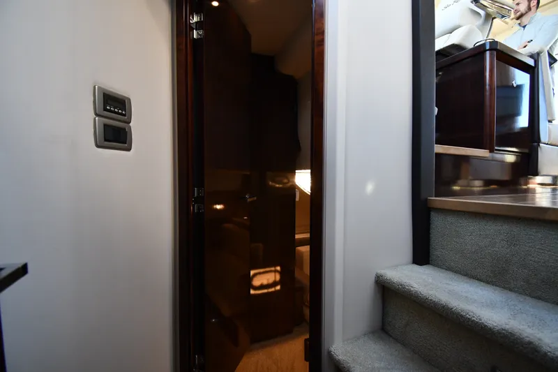 Slide: The Image of Interior view of 2017 Sea Ray Sundancer 400 yacht, featuring stairs and a cabin doorway. - 26