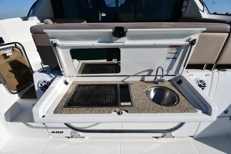 Slide: The Image of Outdoor kitchenette on 2017 Sea Ray Sundancer 400 yacht with grill and sink. - 12