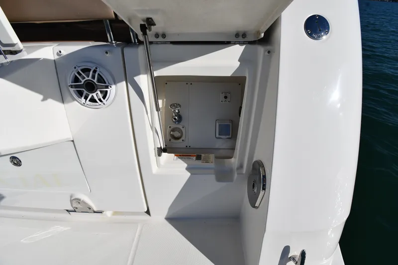 Slide: The Image of 2017 Sea Ray Sundancer 400 yacht deck with speaker and utility compartment. - 13