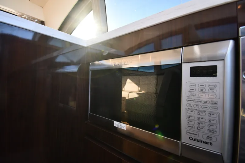 Slide: The Image of Cuisinart microwave in 2017 Sea Ray Sundancer 400 yacht kitchen, sunlight streaming through window. - 45