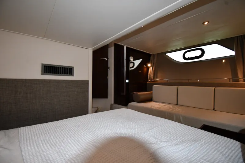 Slide: The Image of Luxurious interior of 2017 Sea Ray Sundancer 400 yacht cabin with modern furnishings. - 30