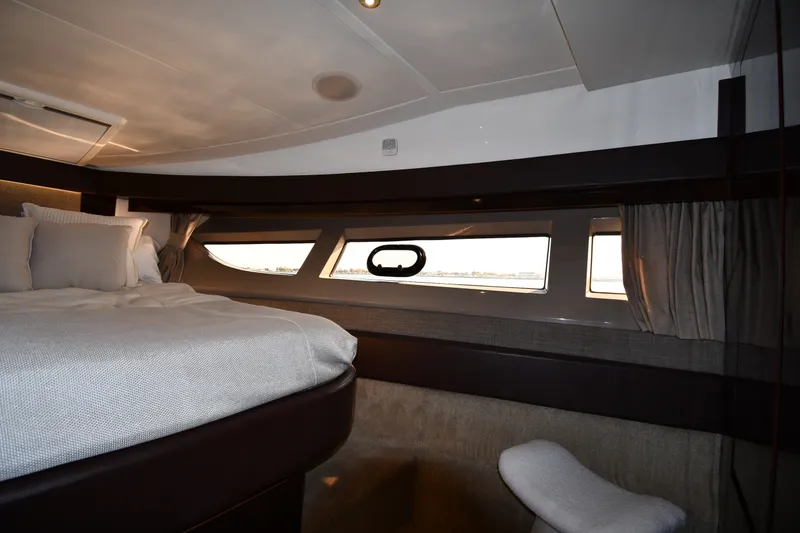 Slide: The Image of Luxurious cabin interior of 2017 Sea Ray Sundancer 400 yacht with large windows and cozy bedding. - 17
