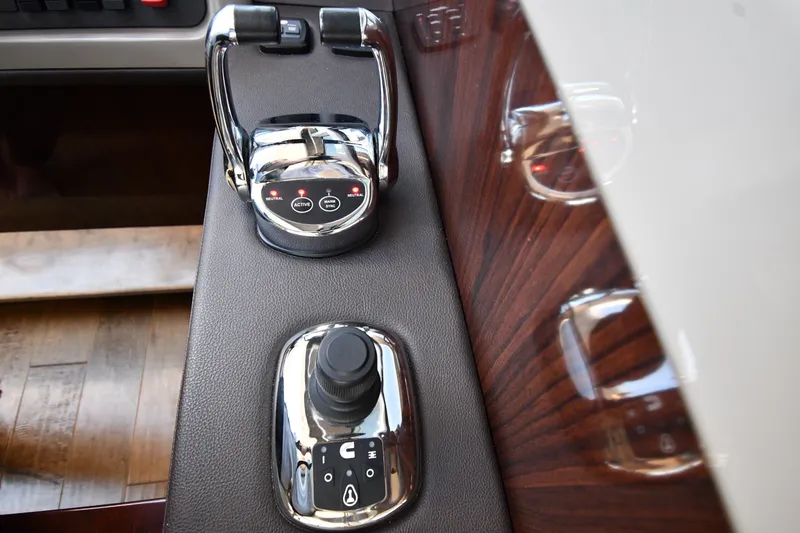 Slide: The Image of Control panel of a 2017 Sea Ray Sundancer 400 yacht, featuring throttle and joystick controls. - 41