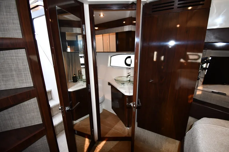 Slide: The Image of Luxurious 2017 Sea Ray Sundancer 400 yacht interior with modern bathroom and elegant wood finishes. - 22