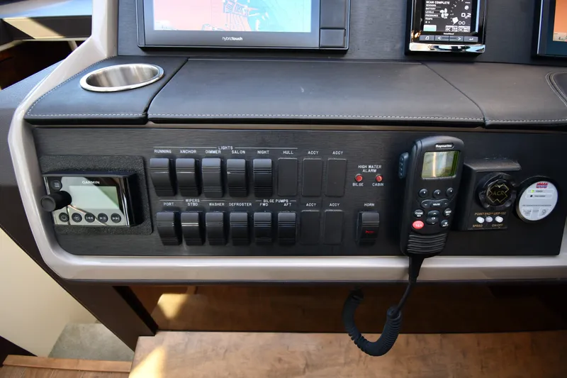 Slide: The Image of Control panel of a 2017 Sea Ray Sundancer 400 yacht with navigation and communication equipment. - 39