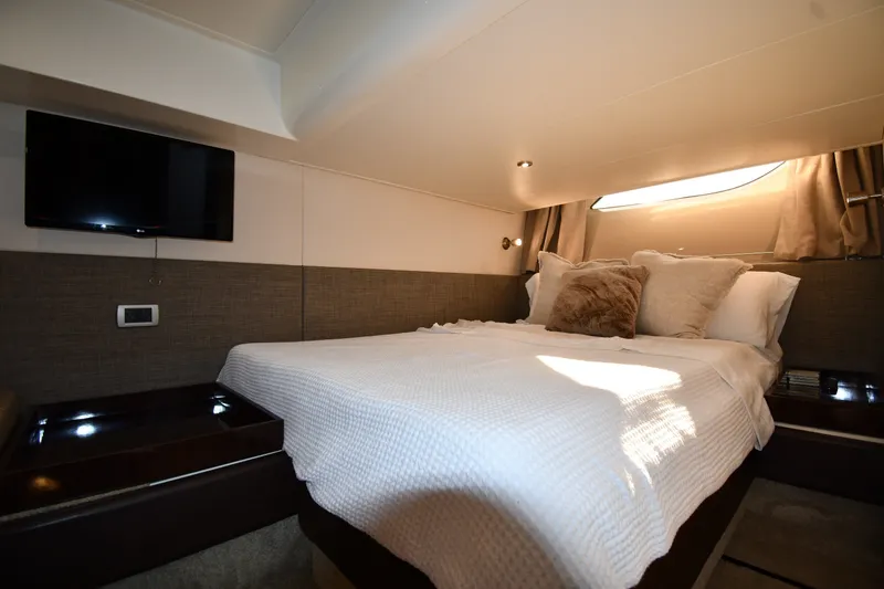 Slide: The Image of Luxurious cabin interior of 2017 Sea Ray Sundancer 400 yacht with cozy bed and TV. - 28