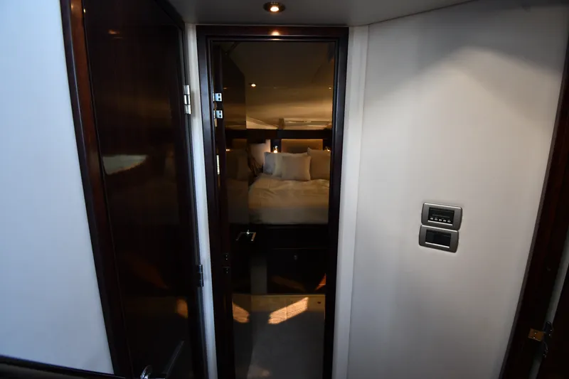 Slide: The Image of Interior cabin view of 2017 Sea Ray Sundancer 400 yacht, featuring a cozy bedroom. - 15