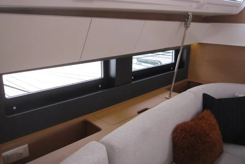 Slide: The Image of Interior of 2027 Jeanneau Sun Odyssey 455 yacht with modern seating and windows. - 4