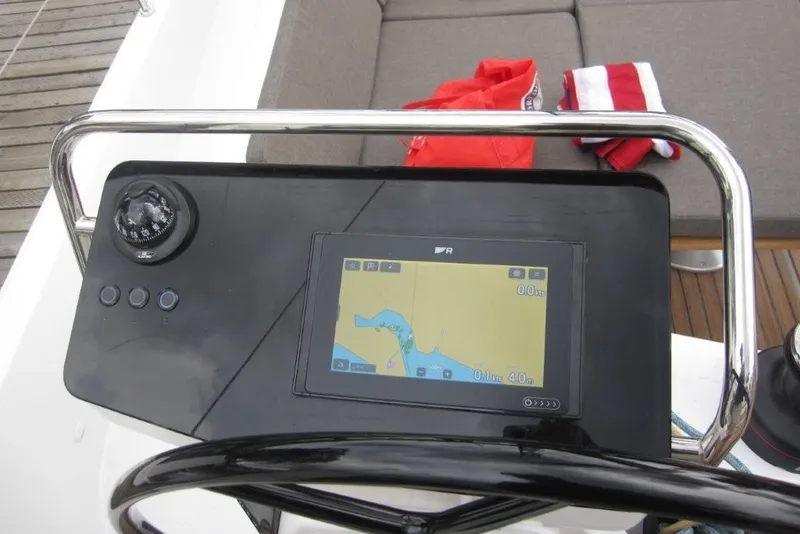 Slide: The Image of Helm of 2027 Jeanneau Sun Odyssey 455 with navigation display and compass. - 36