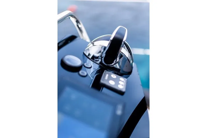 Slide: The Image of Close-up of Jeanneau Sun Odyssey 455 yacht controls, 2027 model, with sleek design. - 38
