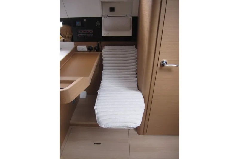 Slide: The Image of Interior of 2027 Jeanneau Sun Odyssey 455 yacht with cushioned seating area. - 12