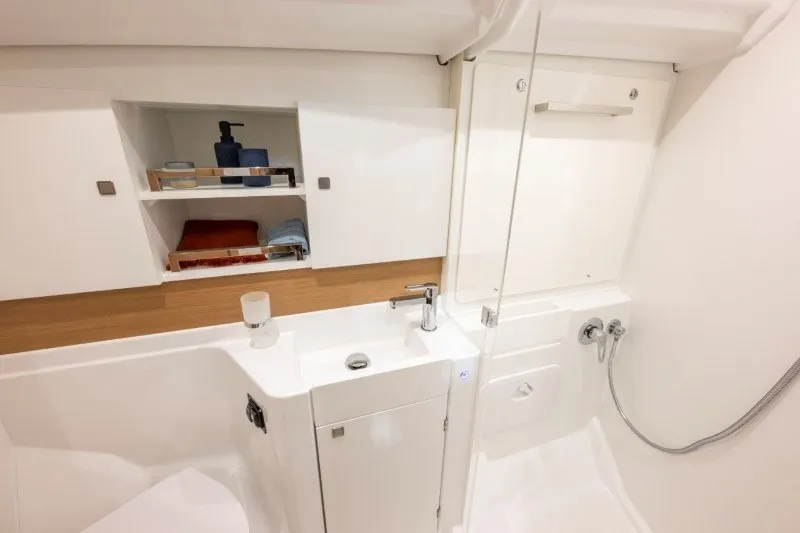 Slide: The Image of Modern bathroom interior of 2027 Jeanneau Sun Odyssey 455 yacht, featuring sleek design and amenities. - 26