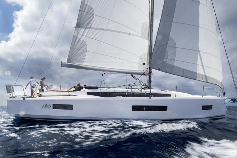 Slide: The Image of Manufacturer Provided Image: 2026 Jeanneau Sun Odyssey 455 sailing on open water under cloudy skies. - 42
