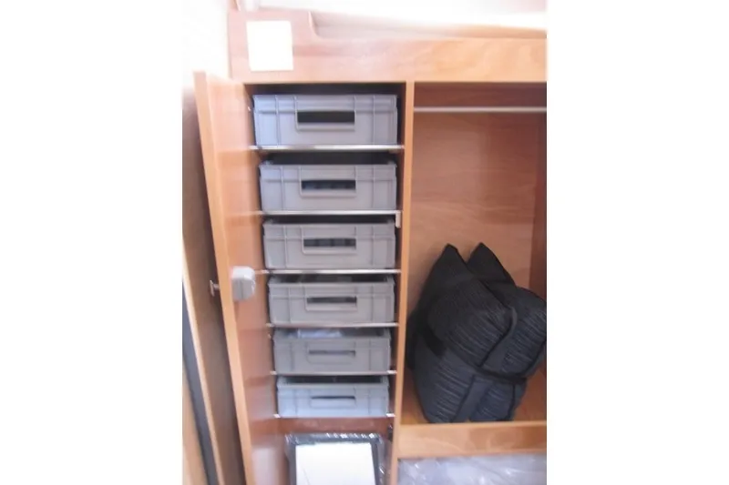 Slide: The Image of Storage area with organized bins and cushions on Jeanneau Sun Odyssey 455, 2027 model. - 22