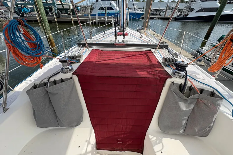 Slide: The Image of Cockpit view of a 2004 Catalina 310 sailboat docked at a marina. - 14