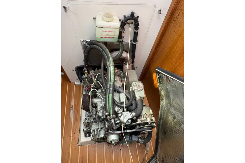 Slide: The Image of Engine compartment of a 2004 Catalina 310 sailboat, featuring a Westerbeke engine. - 30