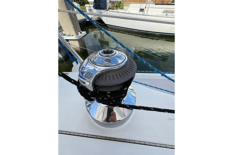 Slide: The Image of Winch on 2004 Catalina 310 sailboat with ropes, docked in marina. - 13