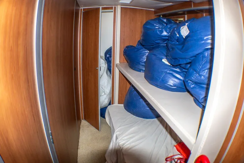 Slide: The Image of Interior of 2013 Silver Ships Barrows 60 with wooden paneling and storage shelves. - 19