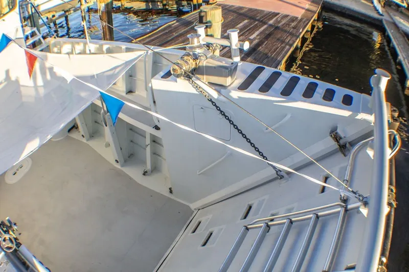 Slide: The Image of Deck view of 2013 Silver Ships Inc Barrows 60 boat with colorful flags. - 7