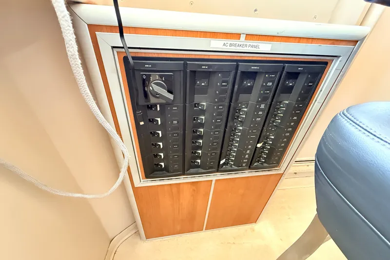 Slide: The Image of AC breaker panel on a 2013 Silver Ships Inc Barrows 60 boat. - 24