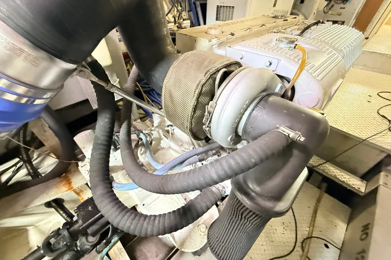 Slide: The Image of Engine compartment of 2013 Silver Ships Inc Barrows 60, showcasing mechanical components and hoses. - 36