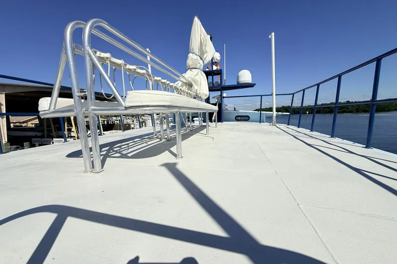 Slide: The Image of Deck view of 2013 Silver Ships Inc Barrows 60 boat with railing and seating. - 33