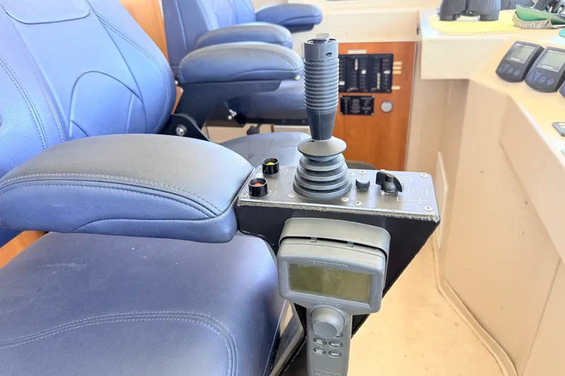 Slide: The Image of Control panel and seating inside a 2013 Silver Ships Inc Barrows 60 vessel. - 30