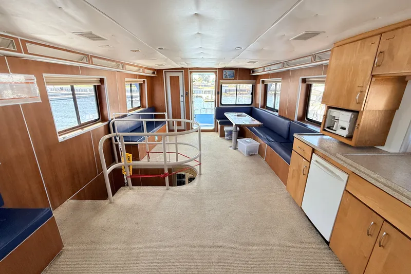Slide: The Image of Interior of 2013 Silver Ships Inc Barrows 60 with seating, kitchenette, and windows. - 15
