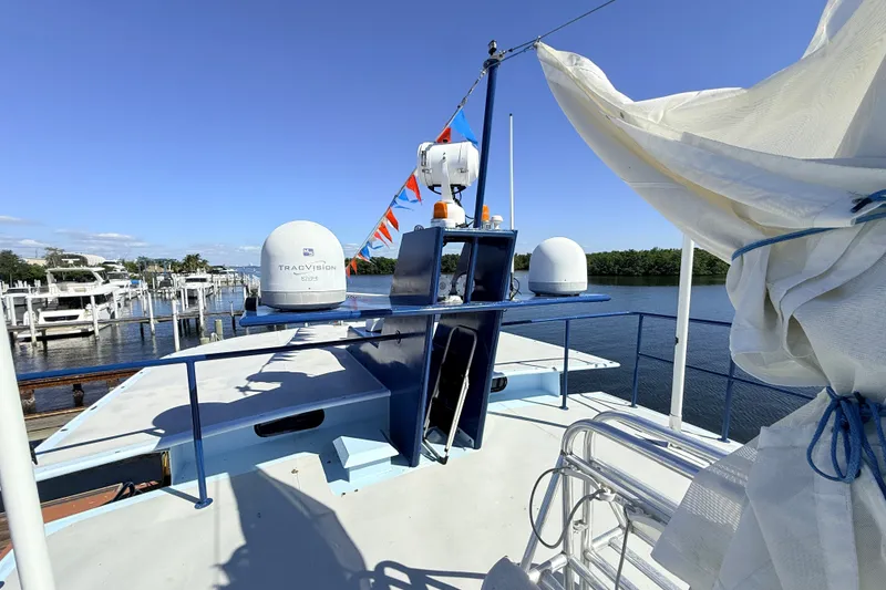 Slide: The Image of Deck view of 2013 Silver Ships Inc Barrows 60 with radar equipment and marina backdrop. - 32