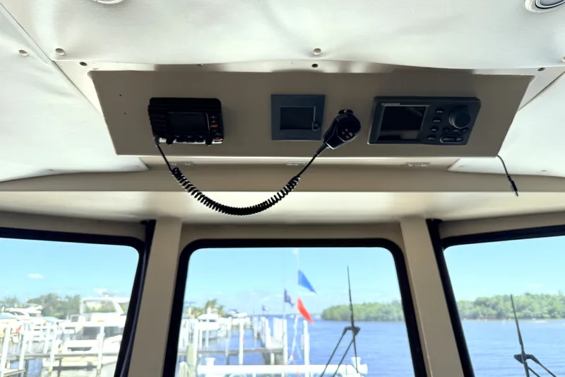 Slide: The Image of Interior view of 2013 Silver Ships Inc Barrows 60 boat cockpit with communication equipment. - 28