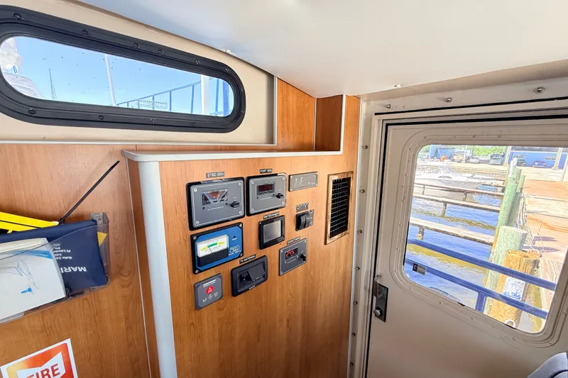 Slide: The Image of Interior view of 2013 Silver Ships Inc Barrows 60, featuring control panel and window. - 21