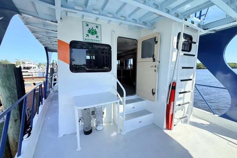 Slide: The Image of Exterior view of 2013 Silver Ships Inc Barrows 60, featuring muster point and safety equipment. - 4