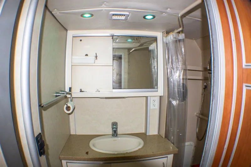 Slide: The Image of Bathroom interior of 2013 Silver Ships Inc Barrows 60 with sink and shower. - 31