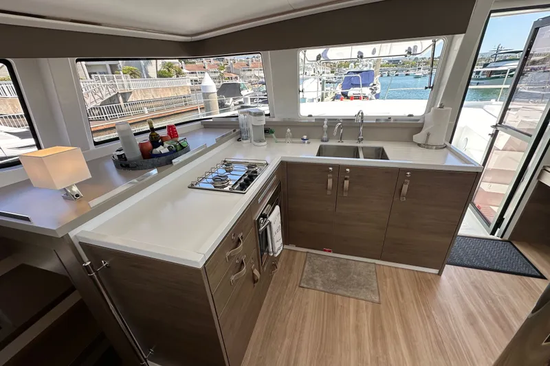 Slide: The Image of Modern kitchen interior on a 2023 Bali 4.4 yacht, featuring sleek cabinetry and ocean view. - 60