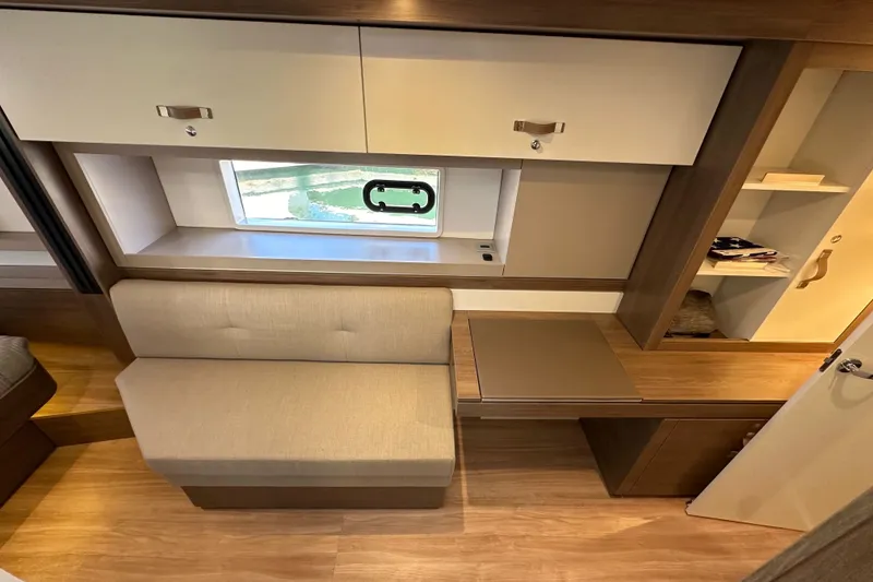 Slide: The Image of Modern interior of 2023 Bali 4.4 yacht with seating, window, and storage. - 68