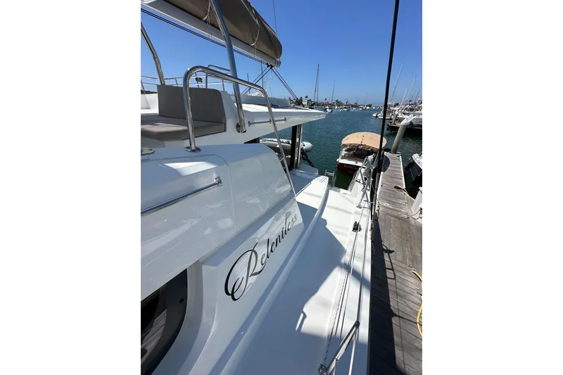 Slide: The Image of 2023 Bali 4.4 yacht docked at marina under clear blue sky. - 30