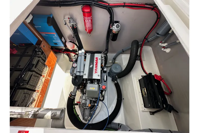 Slide: The Image of Engine compartment of a 2023 Bali 4.4 yacht, featuring Yanmar engine and electrical components. - 103