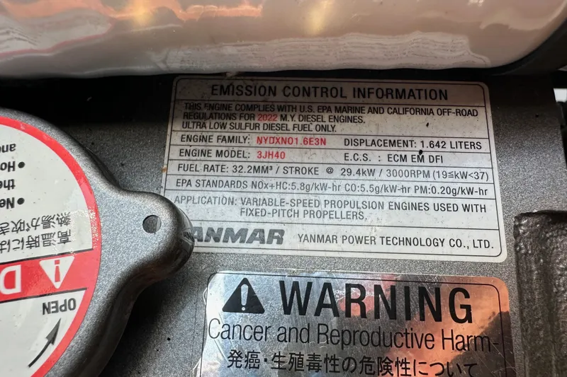 Slide: The Image of Emission control label on a 2023 Bali 4.4 engine, detailing compliance and specifications. - 108