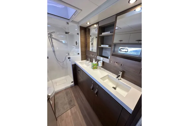 Slide: The Image of Modern bathroom in 2023 Bali 4.4 yacht with dual sinks and shower. - 78