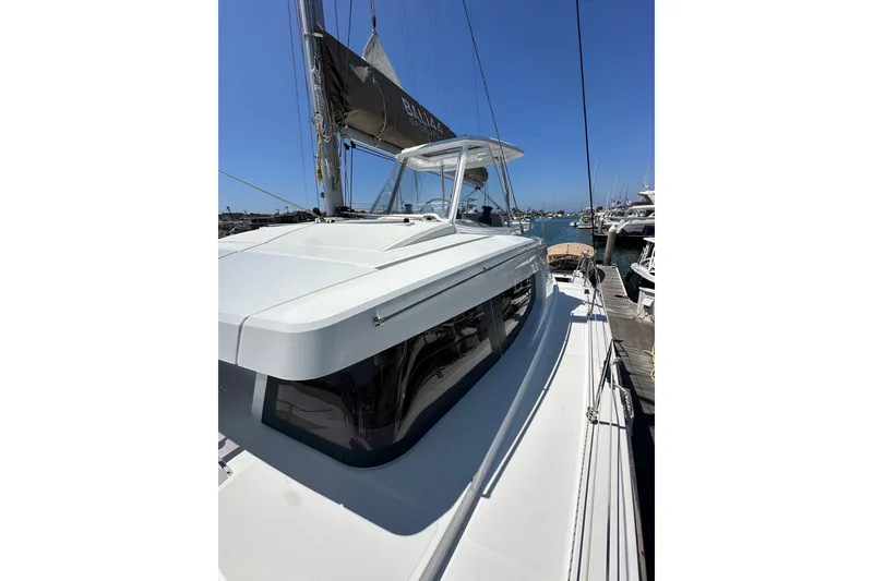 Slide: The Image of 2023 Bali 4.4 yacht docked at marina under clear blue sky. - 28
