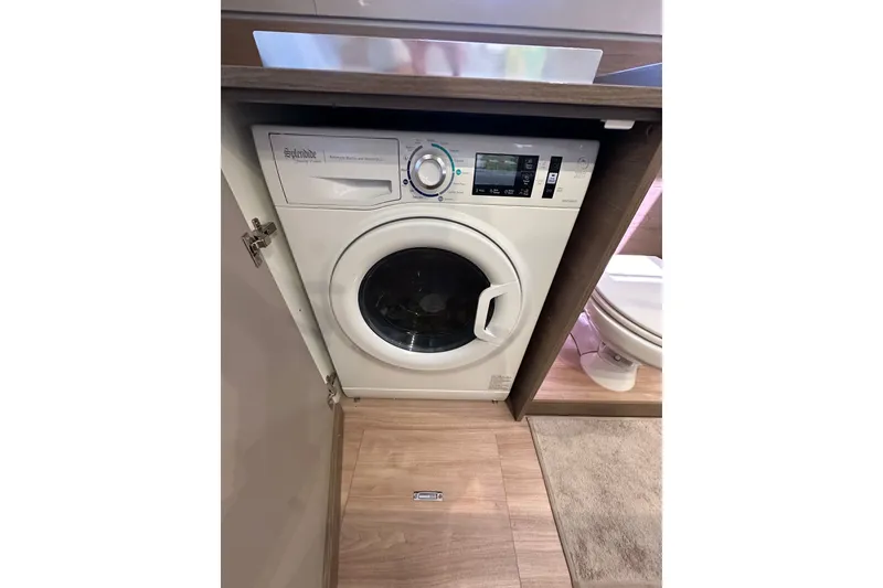Slide: The Image of Compact washing machine in a modern bathroom, Bali 4.4 model, 2023. - 80