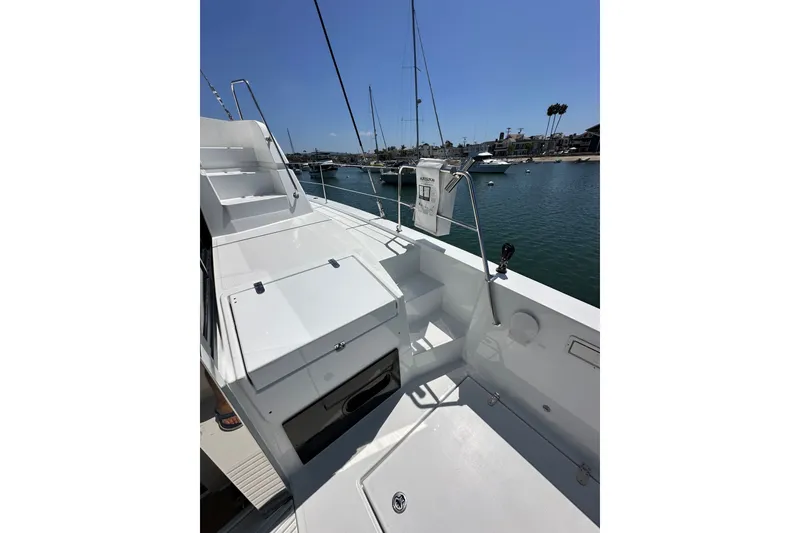 Slide: The Image of 2023 Bali 4.4 yacht deck with sleek design, docked in a serene marina. - 17