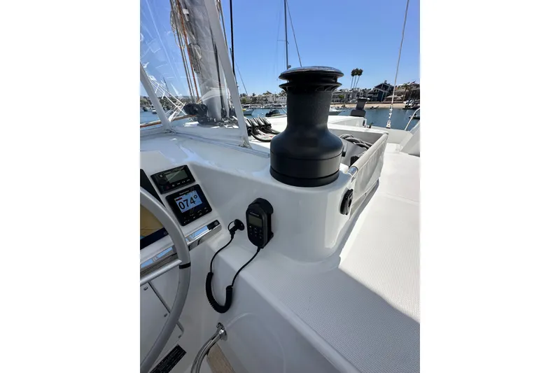 Slide: The Image of Cockpit of 2023 Bali 4.4 yacht with navigation instruments and winch, docked in marina. - 41