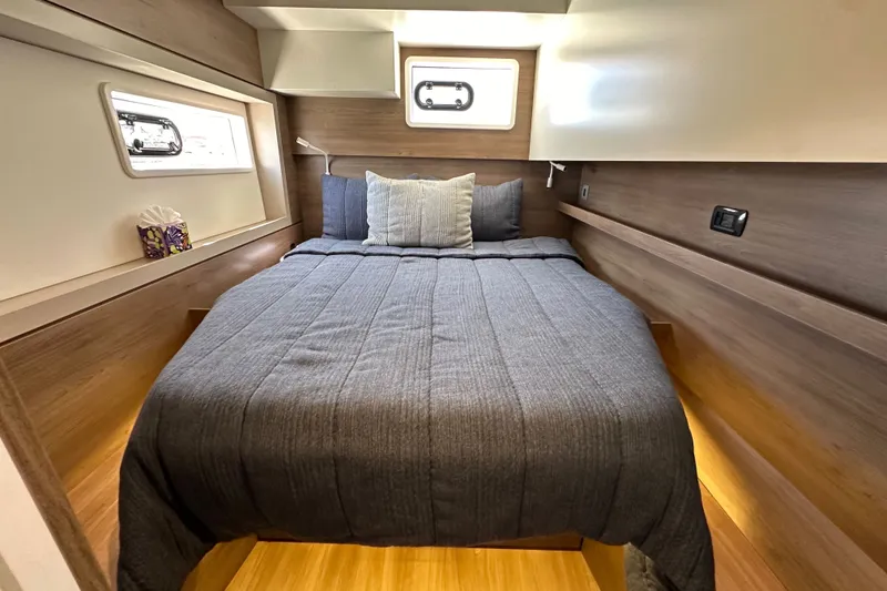 Slide: The Image of Cozy bedroom in 2023 Bali 4.4 yacht with modern wood paneling and soft lighting. - 98