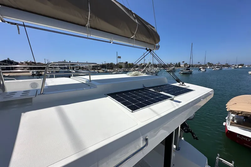 Slide: The Image of Sailing catamaran Bali 4.4 (2023) with solar panels docked in a marina. - 31