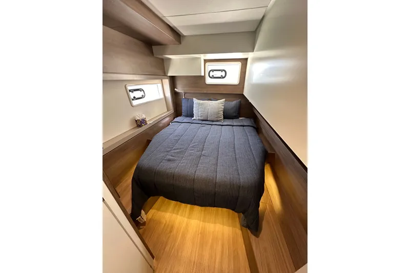 Slide: The Image of Cozy bedroom in 2023 Bali 4.4 yacht with modern wood interior design. - 97