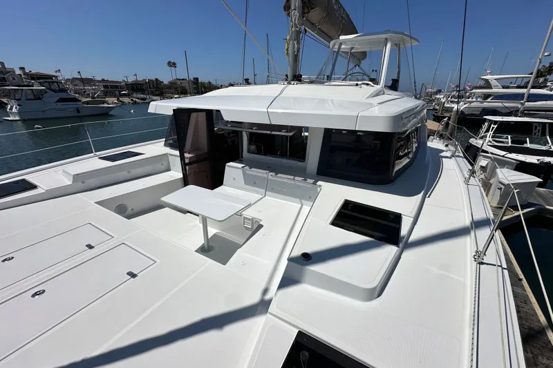 Slide: The Image of 2023 Bali 4.4 yacht docked at marina, featuring spacious deck and modern design. - 27